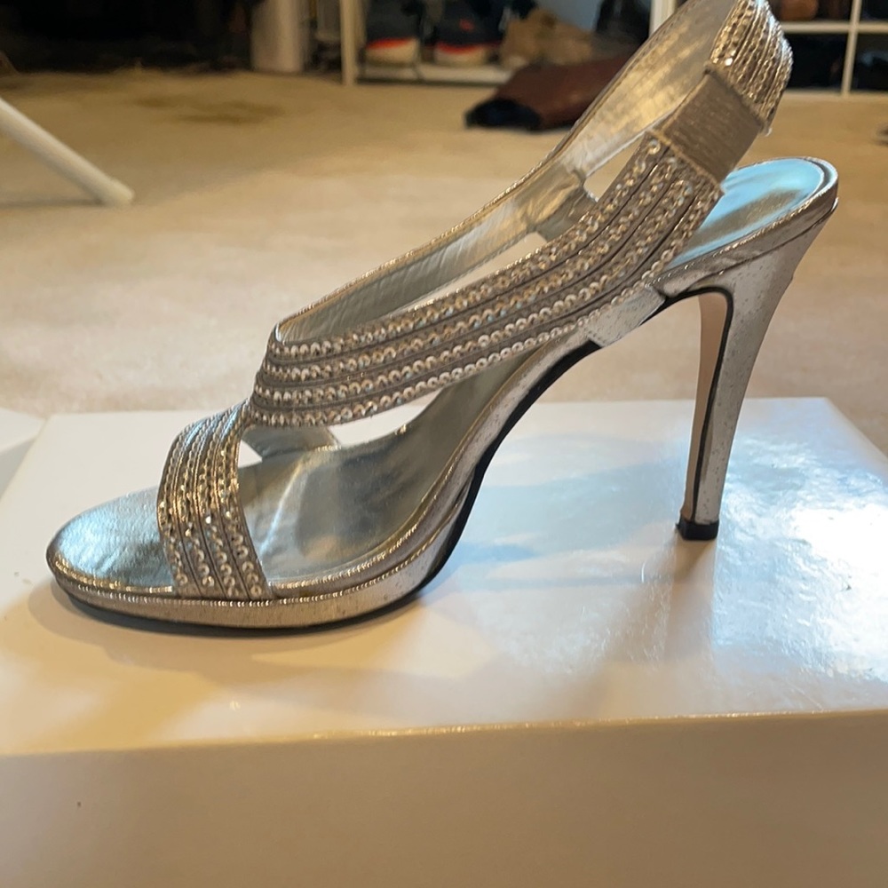 Women’s silver heels, size 6.5, worn twice.